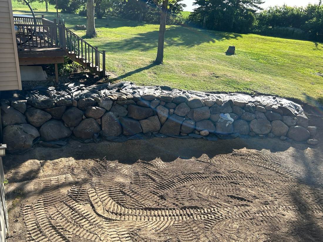Boulder retaining wall, second angle, mid-install